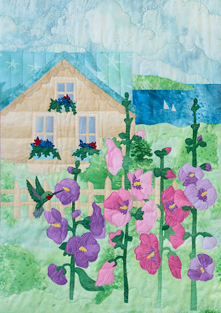 Quilt block of summer house that overlooks the bay, with cheerful pink and purple hollyhock flowers in the front yard.