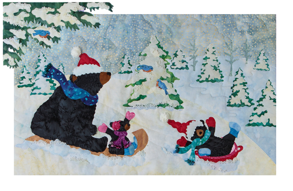 A quilt block with mama bear and her two babies sledding down a snowy hill.