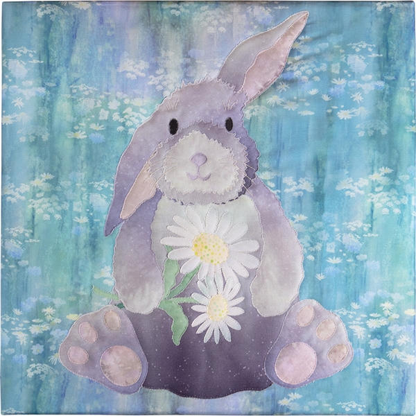 A floppy-eared Bunny holds daisies