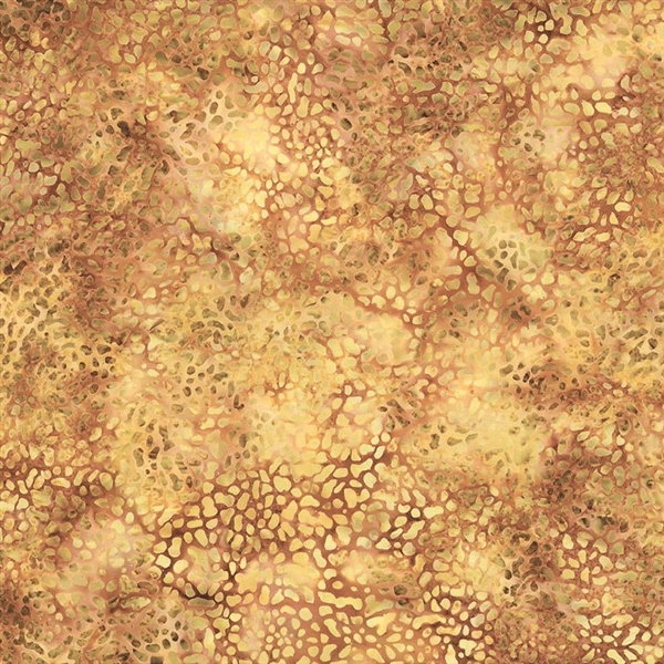 Batik fabric in reptile print in pale gold on an amber background