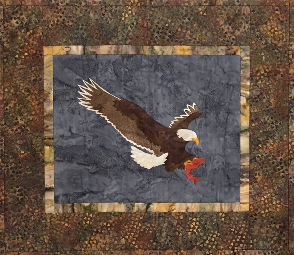 Quilt block of an eagle catching a trout