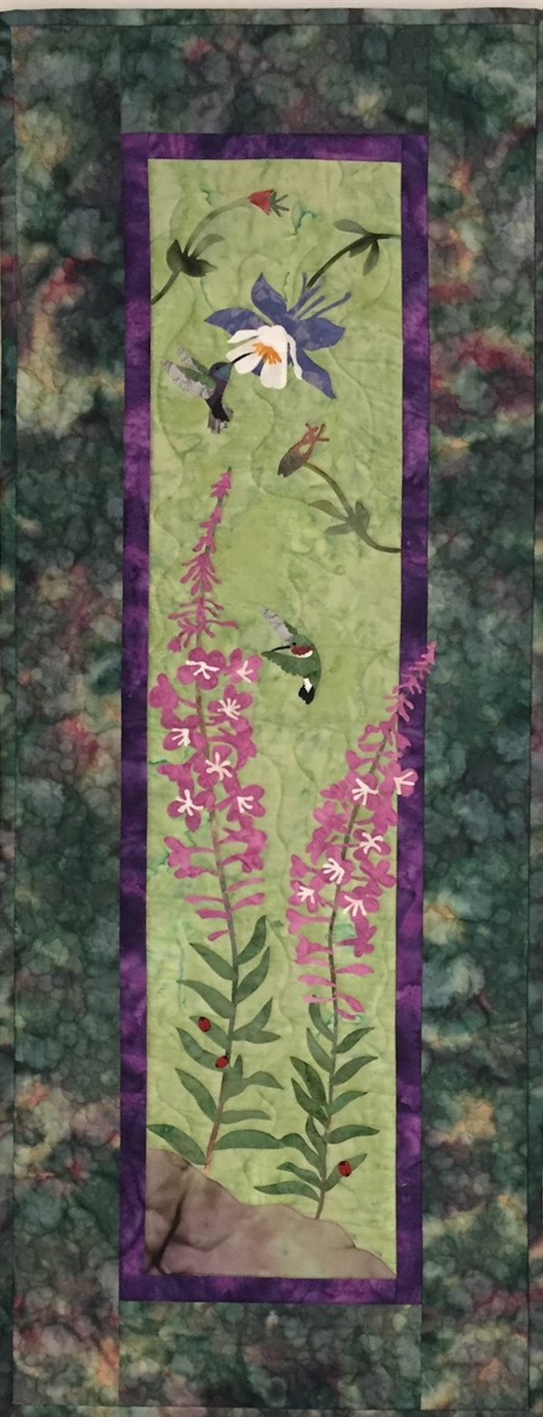 Quilt block of the wildflowers Fireweed and Columbine, being visited by hummingbirds.