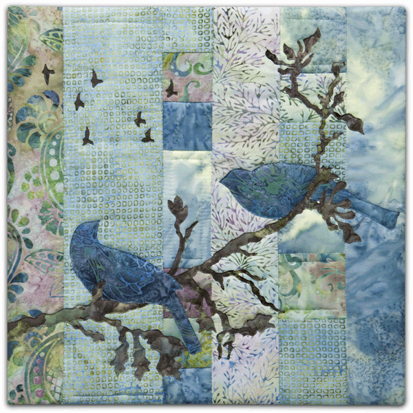 Quilt block with stylized bird on a tree branch in purple and green floral patterns