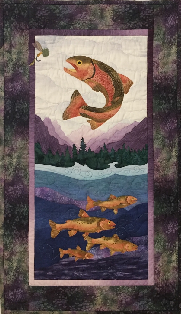 Quilt block of a rainbow trout leaping to catch a fly, as his smarter school swims safely underneath.