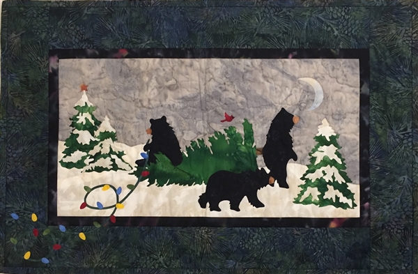 Three black bears decorate trees with colored lights.