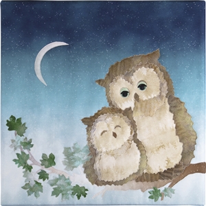 In the moonlight a mama Owl and her baby snuggle on a branch