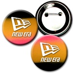 Lenticular button with red, yellow, and black gradient, color changing 2 inch diameter