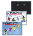 Lenticular button with orange and yellow snow skiiers jump off a mountain, flip