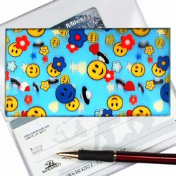 Lenticular checkbook cover with happy faces, stars, clouds, and space ships, depth