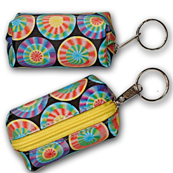 Lenticular Purse key chain with rainbow wheels spin around on a dark blue background