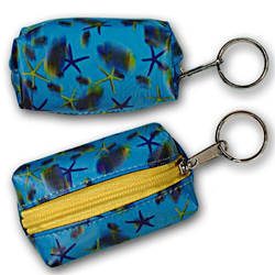 Lenticular purse key chain with sea stars, fish, and sea shells on a light blue background, depth