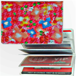 Lenticular credit card ID holder with mushrooms, stars and t-shirts on a pink background, depth