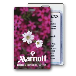 Lenticular luggage tag with bed of pink flowers inside a beautiful spring garden, depth