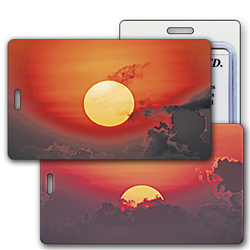 Lenticular luggage tag with large yellow sun rising from behind a blanket of grey clouds, flip