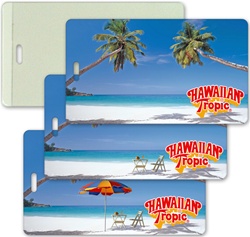 Lenticular luggage tag with  palm trees, umbrella, and lawn chair appear on a tropical Hawaiian beach, flip