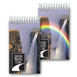 Lenticular mini notebook with mystical rainbow appears in front of a tropical Hawaiian cliff waterfall