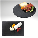 Image of all four serving board shapes, rectangular, round, square, and paddle with cheese and crackers on top of black slate.