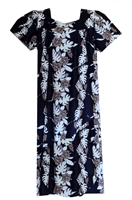 â€‹Black mid-calf Hawaiian muumuu with 7 panels of flowers and monstera leaf.