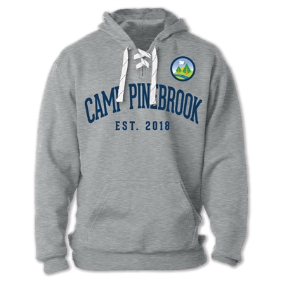 Sport Lace Hoodie made of 10 oz. blend of ringspun cotton/polyester. Printed with Camp Pinebrook logo left chest and Camp Pinebrook est. wordmark across the chest.