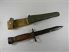 EARLY ITALIAN CARBINE BAYONET WITH WOOD HANDLE AND LEATHER SCABBARD.