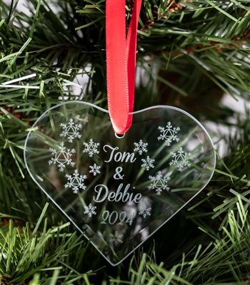 The 2023 -Couple in Recovery ornament is a personalized Recovery Ornament featuring snowflakes and a personalized message that includes your name or names (Crissy & Josh are the names engraved on the featured image)