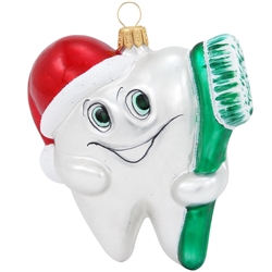 Our sweet tooth's advice...enjoy your candy canes and sugar cookies, but don't forget to brush those pearly whites! Masterfully crafted of glass in Poland, this whimsical keepsake depicts a dazzling tooth capped in a jaunty Santa hat holding a gleaming to