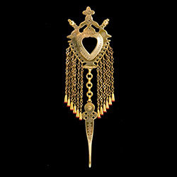 This Gorale pin is normally worn on the shirt. Hand worked from brass with intricate detailing by one master artisan in Bukowina near Zakopane. The workmanship is exquisite and the detail so rich these decorations have become collector's items and can be