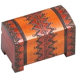 Mountain Chest Wooden Box. This warm colored box is a chest style with a footed base. A handcarved zig-zag and banded pattern wraps over the top from the back to the front.