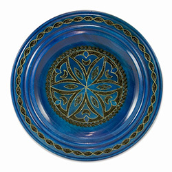 Hand Made in Southern Poland Polish wooden plates are made from Linden wood in the mountain region of southern Poland called Podhale. The plates are cut and shaped on a lathe by hand. The floral designs are burned into the wood then painted after staining