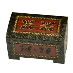 Footed base, curved top, elaborate decoration on top and all sides. Brass inlay, flat finish.