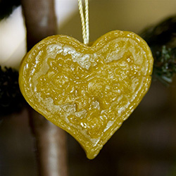 This pure beeswax heart is hand made by the residents of Dom Teczowy, a home for the mentally impaired located in Sopot, Poland.  Your purchase helps to support the Dom Teczowy Foundation that provides the care for the residents.