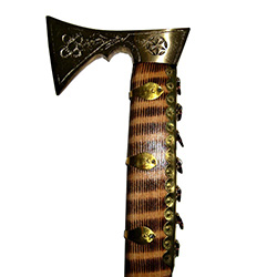 The ciupaga is the Polish mountaineer's combination mountain axe and walking stick. This model has a beautiful solid brass head. Made in Zakopane the main body has a zebra stripe pattern in the wood grain. Perfect for display or use by folk dance students