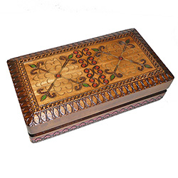 This box is decorated with a dual floral design created and accented with metal inlay.