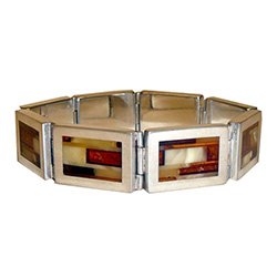 Simply gorgeous men's sterling silver bracelet, with an inlaid mosaic pattern of yellow, cream, honey, and cherry amber stones.