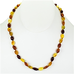 Lovely necklace composed of cherry, custard, light and dark honey Amber.
Oval Amber Bead size 3/8" long by 1/4" wide
Gold colored cord w/ knot between each bead
Silver claw clasp closure