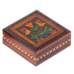 Inlaid Floral Box. This box features a brightly colored floral design accented with metal inlay and set against a carved, burned texture background.