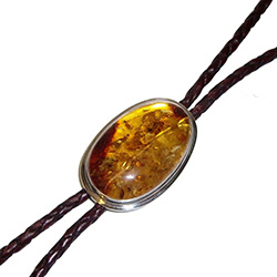 Beautiful light brown braided leather bolo tie with a large centerpiece of honey amber set in a sterling silver casing. Braided leather lanyard.  Silver tipped ends.