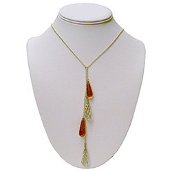 Very elegant use of sterling silver and amber formed into tear drop shapes hanging delicately on a sterling silver chain.