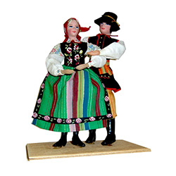 Just west of Warsaw is the town of Lowicz and the center of a region famous for its variety of folk art and colorful costumes.  Our couple are featured in their traditional striped costumes.