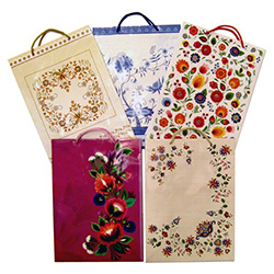 Delightful Polish folk themed paper gift bags are the perfect way to present those special gifts.  Glossy color paper with cloth handles, cardboard bottom insert for added strength and all made in Poland.  Set of 5 different patterns.