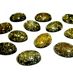 Approx .5" x .75" x .25: thick - 15mm x 20mm x 6mm thick.  These oval domed amber cabochons have backs painted black which produces their green color.  Price is per piece.