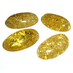 Approx .56" x 1" x .25" thick - 15mm x 25mm x 6mm thick.  These oval domed amber cabochons have backs painted black which produces their green color.  Price is per piece.