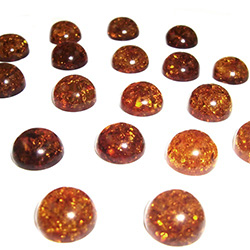 Approx .375" x .25: thick - 10mm x 6mm thick.  These are round domed amber cabochons.  Price is per piece.