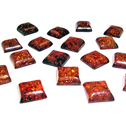 Approx .5" x .5" x .25" thick - 11mm x 11mm x 6mm thick.  These are square domed amber cabochons.  Price is per piece.