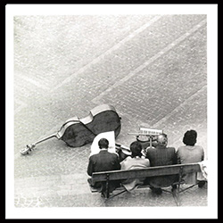 1974.  Musicians at rest.  Our quartet appears to be taking a break between sets on an unidentified street in Poland.  Streets bands have always been quite popular in Poland and especially in Warsaw.  Historical Black and White Photo Postcard