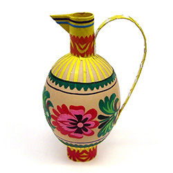 Decorating eggs with paper cuts is a tradition from the Lowicz region of central Poland.  Cleverly created to make a folk jug. Hand made by master artist Danuta Wojda. Assorted designs and colors.  No two are exactly alike.