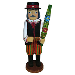 Our man from Lowicz is in full costume and carrying a Polish Easter palm. In Poland Easter palms are made from dried woven flowers and are very colorful. Carved and painted by Zbigniew Suchinski.
