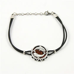 Sterling Silver and Baltic amber Pisces zodiac sign charm on a durable cord made of black rubber.