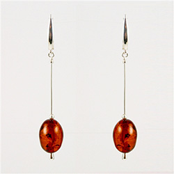 Two large amber cabachons suspended on silver chains with European clasps.  Stylish and unique.