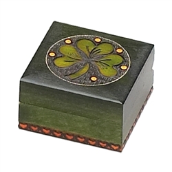 A Bit More Luck Shamrock Polish Box. This Irish green box features a shamrock inside a metal inlaid circle with red circles for accent. Entire design is hand-carved.